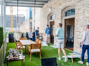 Employees playing cornhole