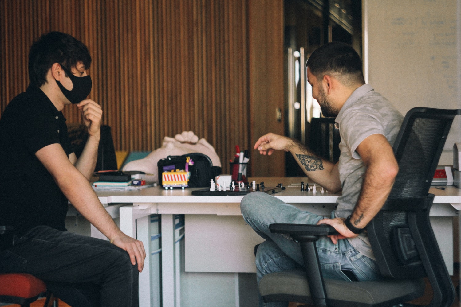 Employees playing a game of chess