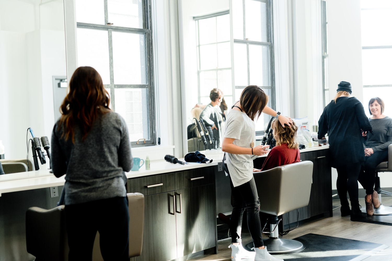 Body image - Hairdressers cutting hair in a salon